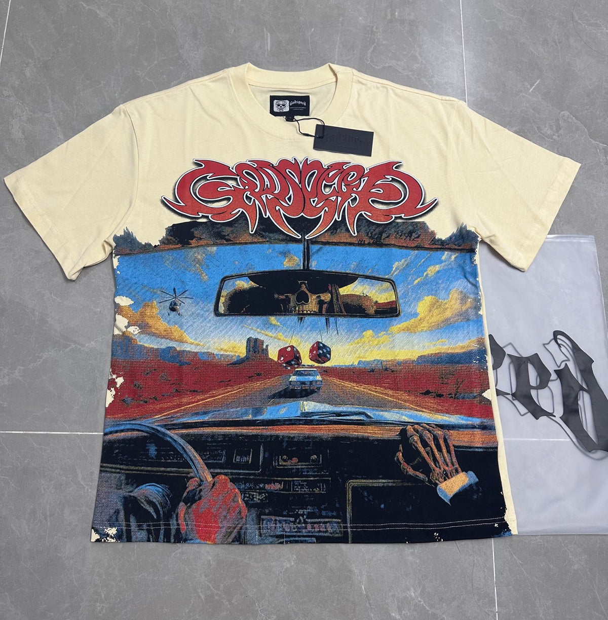 Godspeed Desert Road Trip Skeleton Driving Short Sleeve Tee (Cream Off‑White)